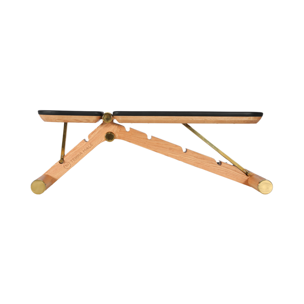 Adjustable training bench in solid ash with brass hardware, branded TERRA HALE