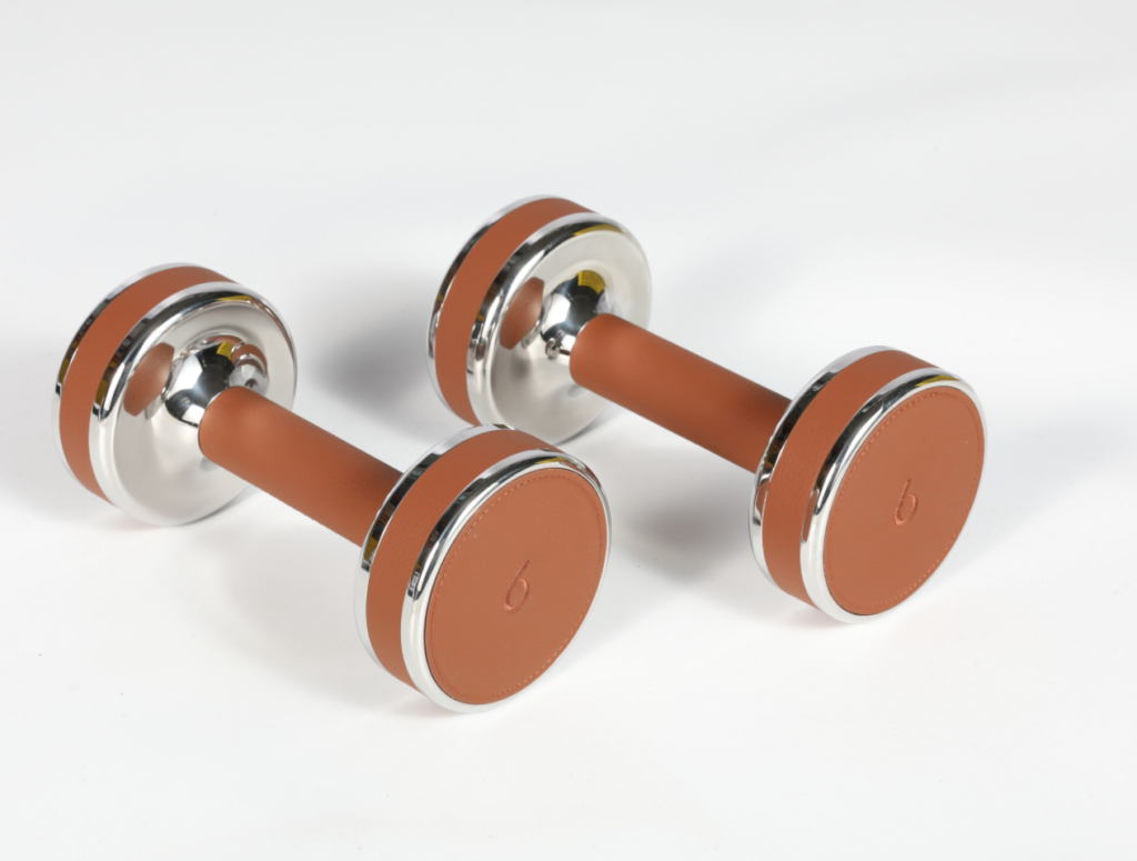 Pair of leather-wrapped dumbbells with copper end plates