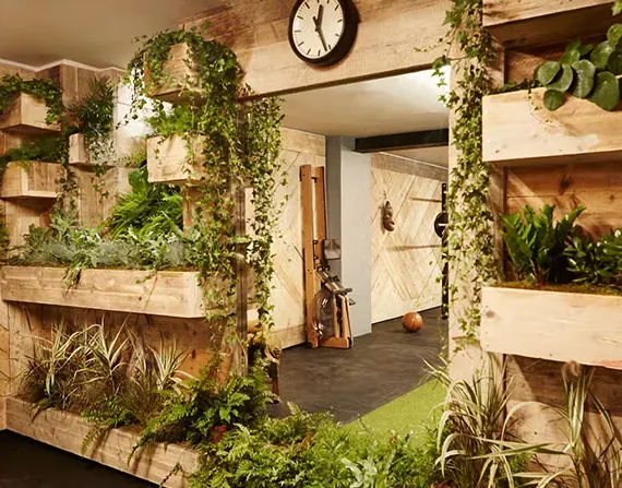 Private studio with reclaimed timber walls and vertical planters